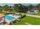 Aerial view of pool with plenty of chairs and nice landscaping at 5980 80Th N St # 408, St Petersburg, FL 33709