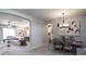 Inviting living room featuring neutral décor, comfortable seating, and open access to dining area at 2626 Scenic Park Loop, Wimauma, FL 33598