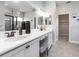 En suite Primary bathroom with dual sinks, decorative lighting and walk in shower at 2626 Scenic Park Loop, Wimauma, FL 33598