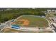Overhead view of the manicured baseball field, with stadium seating and well-maintained grounds at 3608 54Th W Dr # 202, Bradenton, FL 34210