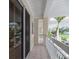 Relaxing porch with sliding glass doors and white railings at 3608 54Th W Dr # 202, Bradenton, FL 34210