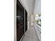 Peaceful covered porch featuring sliding glass doors and white railing at 3608 54Th W Dr # 202, Bradenton, FL 34210