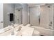Well-lit bathroom with a tiled shower, single vanity, and modern fixtures at 3608 54Th W Dr # 202, Bradenton, FL 34210