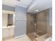 Elegant bathroom with a glass shower, vanity, and tile flooring creating a spa-like retreat at 3608 54Th W Dr # 202, Bradenton, FL 34210