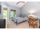 Cozy bedroom with neutral tones, ceiling fan, and window overlooking outdoor greenery at 3608 54Th W Dr # 202, Bradenton, FL 34210