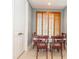 Cozy dining area with wood shutters and neutral tile flooring at 3608 54Th W Dr # 202, Bradenton, FL 34210