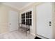 Inviting entryway featuring a window, tiled floor, and convenient bench seating at 3608 54Th W Dr # 202, Bradenton, FL 34210