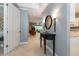 Inviting entryway with a decorative mirror, console table, and neutral color palette at 3608 54Th W Dr # 202, Bradenton, FL 34210