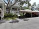 Exterior view of building with parking and landscaping at 3608 54Th W Dr # 202, Bradenton, FL 34210