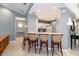 Kitchen bar with seating and views into the kitchen at 3608 54Th W Dr # 202, Bradenton, FL 34210
