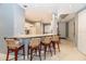 Kitchen bar with seating and views into the kitchen at 3608 54Th W Dr # 202, Bradenton, FL 34210