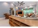 Spacious living room with large windows, ceiling fan, and modern furnishings at 3608 54Th W Dr # 202, Bradenton, FL 34210