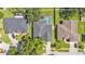 Bird's-eye view of the home highlighting its dark roof, adjacent properties, and lush landscaping at 3911 Smoke Rise Ct, Valrico, FL 33594