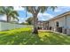 A sprawling green lawn is surrounded by a white privacy fence at 3911 Smoke Rise Ct, Valrico, FL 33594