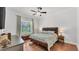 Bright bedroom with hardwood floors and backyard views at 3911 Smoke Rise Ct, Valrico, FL 33594
