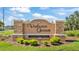 Elegant entrance sign for the Valrico Grove community with manicured landscaping at 3911 Smoke Rise Ct, Valrico, FL 33594