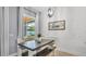 Cozy dining area features a shiplap accent wall, large window, and a stylish pendant light at 3911 Smoke Rise Ct, Valrico, FL 33594