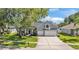 Charming home with a well-manicured lawn and a three-car garage at 3911 Smoke Rise Ct, Valrico, FL 33594