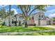 Charming home with a three-car garage, manicured lawn, and beautiful landscaping at 3911 Smoke Rise Ct, Valrico, FL 33594