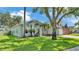 Beautiful single-Gathering home with mature landscaping, arched entryway, and an American flag at 3911 Smoke Rise Ct, Valrico, FL 33594
