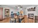 Comfortable home office with hardwood flooring and eclectic decorations to inspire creativity and focus at 3911 Smoke Rise Ct, Valrico, FL 33594