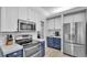 Well-equipped kitchen with stainless steel appliances, subway tile backsplash, and ample cabinet space at 3911 Smoke Rise Ct, Valrico, FL 33594