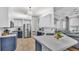 Modern kitchen features stainless steel appliances, custom cabinets, and quartz countertops at 3911 Smoke Rise Ct, Valrico, FL 33594