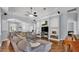 Open concept living room features a large sectional sofa and custom built-ins for storage at 3911 Smoke Rise Ct, Valrico, FL 33594