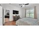 Bright main bedroom featuring hardwood floors and an ensuite bathroom at 3911 Smoke Rise Ct, Valrico, FL 33594