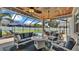 Relaxing screened patio with comfortable seating, perfect for entertaining at 3911 Smoke Rise Ct, Valrico, FL 33594