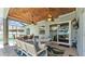Relax on the patio under the fans and enjoy a meal or a game on the comfortable furniture at 3911 Smoke Rise Ct, Valrico, FL 33594