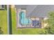 Aerial view of a screened-in kidney-shaped pool with patio furniture and pristine green lawn at 3911 Smoke Rise Ct, Valrico, FL 33594