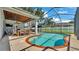 This covered patio and pool is a great space for entertaining at 3911 Smoke Rise Ct, Valrico, FL 33594