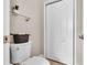 Cozy powder room with modern toilet and small shelf at 3911 Smoke Rise Ct, Valrico, FL 33594