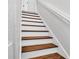 Classic staircase with wood treads and white risers at 3911 Smoke Rise Ct, Valrico, FL 33594