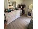 Bedroom showing dresser with mirror and nearby organizers at 704 Queens Ct, Seffner, FL 33584