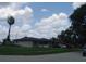 Charming single-story home with a well-maintained lawn and tidy landscaping features at 704 Queens Ct, Seffner, FL 33584