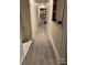 Bright hallway features modern floors and a storage closet at 704 Queens Ct, Seffner, FL 33584