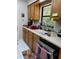 Functional kitchen with natural wood cabinets and lots of counter space at 704 Queens Ct, Seffner, FL 33584
