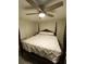 Relaxing bedroom with a four-poster bed, ceiling fan and soft, natural lighting at 704 Queens Ct, Seffner, FL 33584