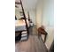 Spacious main bedroom with a four-poster bed, ceiling fan, and hardwood floors at 704 Queens Ct, Seffner, FL 33584