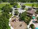Aerial view featuring a community playground with lush landscaping, ideal for Gathering activities and recreation at 1044 Oliveto Verdi Ct, Brandon, FL 33511