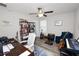 Well-lit room featuring a ceiling fan, a workspace, and a cozy reading corner at 1044 Oliveto Verdi Ct, Brandon, FL 33511
