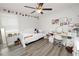 Cozy bedroom with white furniture, hardwood floors, and natural light at 1044 Oliveto Verdi Ct, Brandon, FL 33511