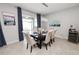 Open concept dining area with seating for six and sliding glass door views at 1044 Oliveto Verdi Ct, Brandon, FL 33511