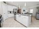 Spacious kitchen featuring a large island with seating and stainless steel appliances at 1044 Oliveto Verdi Ct, Brandon, FL 33511