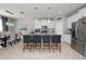 Bright eat-in kitchen with white cabinetry, stainless appliances, and granite countertops at 1044 Oliveto Verdi Ct, Brandon, FL 33511