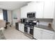 Modern kitchen featuring a stainless steel range with granite countertops at 1044 Oliveto Verdi Ct, Brandon, FL 33511