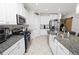 Stylish kitchen featuring granite countertops and stainless steel appliances at 1044 Oliveto Verdi Ct, Brandon, FL 33511