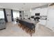 Open-concept kitchen with island seating, and open flow to dining and Gathering area at 1044 Oliveto Verdi Ct, Brandon, FL 33511